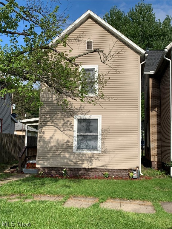 Location is near shops, schools, hospital, and parks. Two bedrooms 2nd floor with a possible 3rd bedroom on the 1st floor. Interior has been completely remodeled including fresh paint from top to bottom and new floor coverings (carpet & laminate). Open concept kitchen and living room area, nicely laid out for cooking, entertaining. A nice sized back yard with alley access and parking, playing or building a garage in the future.
