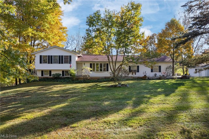 This four level split in Manchester Schools offers four bedrooms and three full baths resting on two parcels totalling 1.8 acres. Property borders 47 acre farm - nature's paradise! Only one neighbor! Large multi-level deck with pergola to enjoy private back yard. Area for hot tub or firepit. Wooden decking walkways surround home. LED landscaping lighting. Collectors dream garages! Four plus car attached garage with heat, air conditioning and hot & cold water. Additional two and a half car detached garage. Additional shed from even more storage. Anderson windows throughout. Newer water softener. Fresh paint throughout. 12 course basement. Stainless steel appliances. Roof 2018. Hot water tank 2019. Newer furnace. Newer entry doors with lifetime warranty. Five camera Arlo security system. Lower level family room has full wall wooden built-in shelves, gas log fireplace and slider to deck. Abundance of heat comes from fireplace. Lower level has additional bedroom and full bath with bear claw tub. Fiber to home for speedy internet. Country living yet minutes away from all that Portage Lakes has to offer! Unique find - won't not last long!