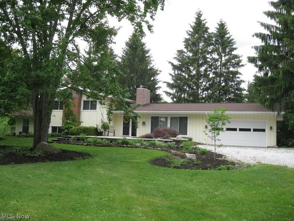 Measure your happiness by the yard! See the forest and the trees! Gardeners and nature buffs will behold a world of wonder on this wonderfully rolling lot. Minutes from downtown Hudson is this tastefully updated and well cared for home, tucked back from the street view on 2.87 acres. Enjoy lovely views of landscaped property via numerous sliding doors and windows. Large living room featuring fireplace and panoramic window. Over size vaulted eat in kitchen, featuring granite counter tops, stainless steel appliances, dbl. oven and much much more. Convenient first floor laundry/mudroom and bath are on this level. Upper level offers three bedrooms and updated full bath. Many possibilities with the oversize bonus room. Great for teenager game room, in home office with separate entrance or many other options. Included is a 775 s.f. heated and cooled outbuilding with plumbing and electricity. Current owner used as dog boarding and grooming business, equipment available. Possible work shop, h