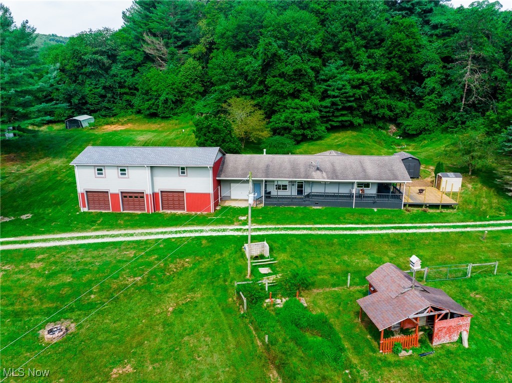 New listing! Discover this stunning 41+/- acre property in Coshocton, OH, perfect as a full-time residence or weekend getaway. The charming 2-bed, 1-bath ranch home features a spacious living room and large eat-in kitchen, while outside you'll find a wraparound deck with a hot tub and a separate firepit deck for relaxing evenings. A newly built two-story, 3-car garage includes an unfinished kitchen, living area with space for additional bedrooms upstairs. The land includes a private well, septic, natural gas, fenced pasture with a small barn, extra open field, and a couple of storage buildings. With wooded acreage, a creek, hunting blind, and potential food plot areas, this property is a haven for wildlife and outdoor enthusiasts. Schedule your showing today!