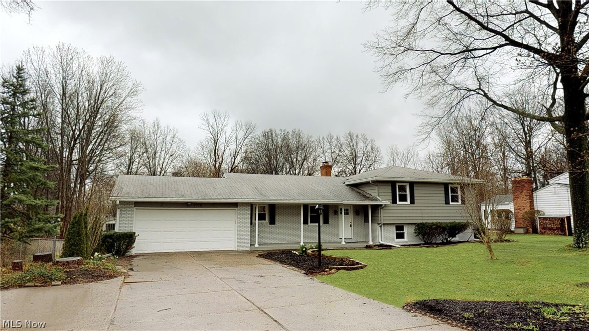 Be careful with this one- if you see it you will love it! Complete rehab, this home is ready for it's new occupants to move in right away! Multiple living spaces will allow buyers to live their lives how they want. Sit by the fireplace looking out at a snowy backyard in winter, or sit on the enclosed porch in summer to enjoy all the seasons Ohio has to offer. The completely redone eat-in kitchen isn't just functional, it has been meticulously completed with granite countertops and matching backsplash. Brand new stainless steel appliances complete the look. Upper floor boasts refinished hardwood floors, while the main floor has stylish durable luxury vinyl plank flooring. Custom master bathroom with tiled rain shower head, and quartz double vanity topped with ample lighting. Half acre lot is completely fenced in and private. In addition to the interior improvements the home has new windows, new A/C unit, updated furnace and electrical and new paint both inside and out.