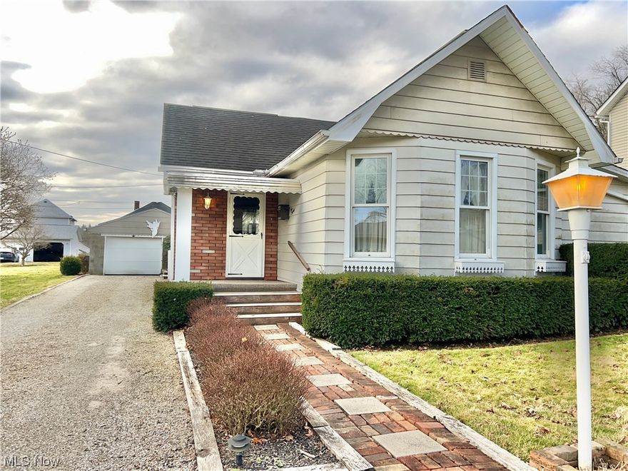 This adorable, well kept home is waiting for you! Walking up the path to the front door you will instantly feel the charm. Upon entering you are greeted by the home's carpeted living room. There are two carpeted bedrooms on either side of the living room, one with cedar-lined closet. The large family room is just off the living room featuring hardwood flooring, and fireplace. The kitchen is fully equipped with space for dining table. There is a refrigerator, stove, oven, microwave, trash compactor and dishwasher. The washer and dryer are conveniently on main floor. The back yard has a small garden pond, wooden deck and beautiful brick patio. There is a small carpeted shed / work shop off the patio and small storage shed in the back yard of the property. The one car garage has attached workshop fully equipped with electric and door opener.