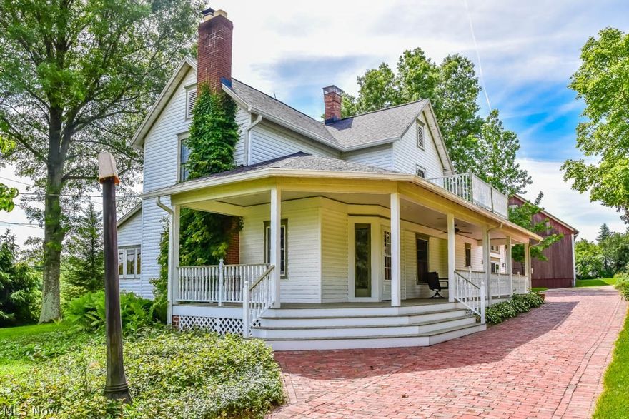 Incredible 4 bedroom, 2 full bath century home on nearly 3 acres in Lake LSD! Updated farmhouse with the history you crave and the modern amenities you require. The exterior is wonderful with a horse barn, multiple outbuildings, rolling acres, a 3-car detached garage and a circle driveway! The horse barn is well maintained with new siding, 12-ft newly poured concrete foundation and professionally straightened. The pavers used on the addition siding, the driveway and the floors of the sunroom are from North Canton streets. The wrap around, covered front porch is 530 square feet with dimmer lights and a fan. Inside, the electric has been updated with dual light switches and automatic lights in the closet. There are new energy efficient, tilt-in windows with full screens. Whip up your favorite recipes in the timeless kitchen with tall cabinets, a wall oven, dishwasher and countertop range. Opening to the roomy dinette with a fireplace. There's a large laundry room off of the kitchen with
