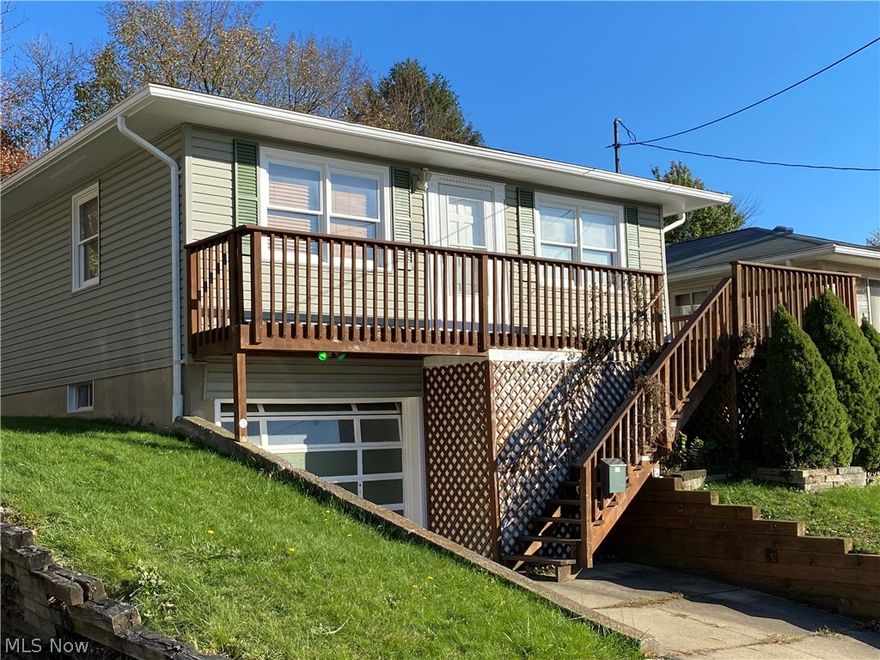 Move right in and enjoy this Ellet raised ranch!  Welcoming open floor plan with a large living room that flows nicely into the dining area and kitchen.  Updated kitchen counter and cabinets with plenty of storage.  Brand new furnace, hot water tank and carpet in the living room!  The full basement includes two utility rooms and a finished rec room and a bonus room!  Attached garage on the lower floor for added convenience.  Relax on the deck out front or enjoy the backyard with the privacy fence.  Put your touches on this cozy home and make it uniquely you!