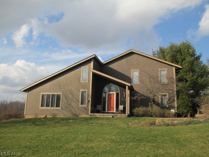 AWESOME 3 BR 2.5 BA CEDAR & BRICK CONTEMPORARY IN GREEN!  Many unique features and is truly a must see.  Oversized concrete driveway leading to a huge 988 sq. ft. 3.5 garage w/new heater 2017 and hot/cold water.  Updated lighting in garage.  This one offers first floor or basement laundry room.  Large kitchen w/center island and new double ovens and fridge (2015).  Huge great room is a must see w/fireplace, Bamboo wood floors and skylights.  First floor master bedroom w/full master suite with large walk-in closet.  Upstairs offers two huge bedrooms both w/walk-in closets.  New water softener/filtration system 2016, and roof 2009.  Back patio and maintenance free deck.  Large back sun room currently being used as an office.  Green Local Schools.  This house will make a great place to call home.