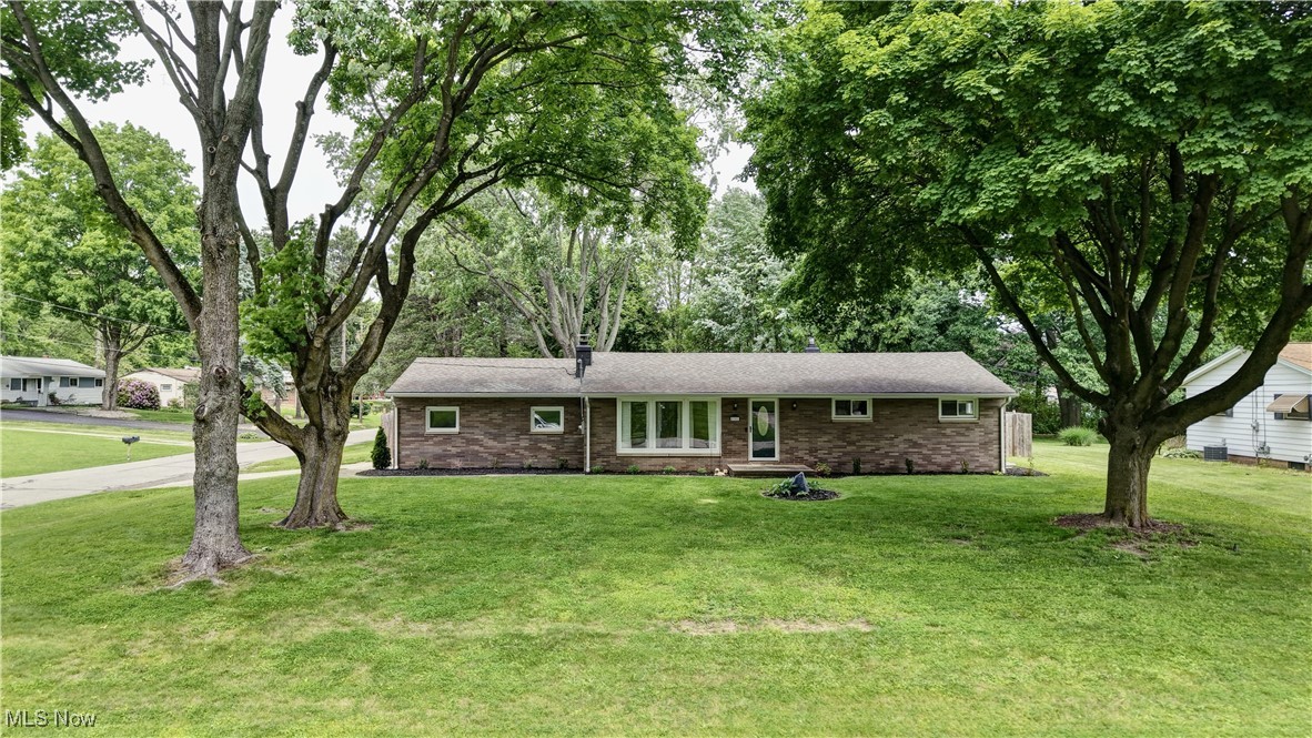 Welcome to this charming brick ranch in the heart of Jackson Township! Located minutes from shopping, restaurants, etc, you will enjoy everything this 4 bedroom and 2 bathroom house has to offer. You'll start in the bright, inviting living room with new picture windows, a gas fireplace and luxury vinyl floor that flows into the eat in kitchen. The eat in kitchen has been remodeled top to bottom with stainless steel appliances, glass tile backsplash and quartz countertops. On the first floor you will also find three bedrooms that have been freshly painted with luxury vinyl floors. The three bedrooms are accompanied by a remodeled full bathroom with tile walls and double sinks. Down in the basement you will find the laundry and storage space as well as a finished rec room with a bar, family room, the fourth bedroom with egress and a beautiful full bathroom. Outside you will enjoy the corner lot with a privacy fence and large yard!
