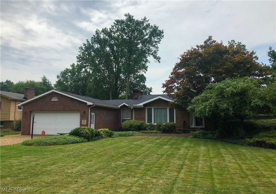 Wonderfully-maintained 3 bedroom, 2 bath brick ranch on a 100x269 lot located in a sought-after Howland neighborhood. Interior highlights include sunken living room with fireplace, updated eat-in kitchen, family room with fireplace, plus finished basement with rec room and full bath. Peel back the carpet and you may find hidden hardwood floors. Summer is going to be a blast in this backyard! It features a 20x40 inground pool, covered hot tub (currently inoperable), deck, patio and outbuilding for storage. Other notables include: 4-car heated tandem garage, all-brick driveway, newer roof, newer furnace/AC and newer H2O tank. This home has everything you need - inside and out!