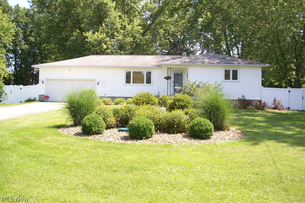 Move in ready 3 bedroom 2 bath ranch sitting on .81 acres. Oversized garage for additional storage with opener and man door for backyard access. Beautiful landscape with a backyard that features a patio and deck off of sliding doors from eat in kitchen, vinyl fence for complete privacy. Updated kitchen with appliances that stay. Hard wood floors throughout. Fresh and clean basement with bath and possible additional living space with plenty of storage. Washer and dryer do not stay.