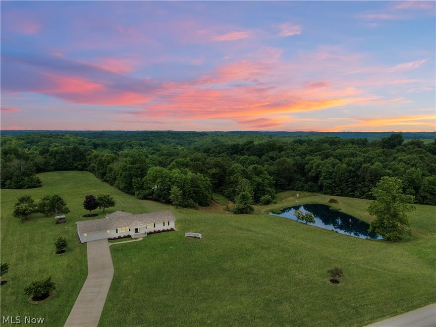 This gorgeous 4.85 acre property with a large, stocked pond and a detached 32x40 three car pole building is one that you definitely do not want to miss! Updated flooring, solid oak kitchen cabinets, and new windows highlight just a few of this home's main attributes. The main floor features two large bedrooms with a full bath on the primary suite and a possible bonus third bedroom or office. The dining room features double doors that look out into the spacious backyard that grow several apple trees. The full basement includes an instant hot water tank, wood burner, ultra high efficiency furnace, double doors and can be converted into additional living space. This home has a new public water line (spring water as a secondary source) and has been freshly painted on the inside and out.