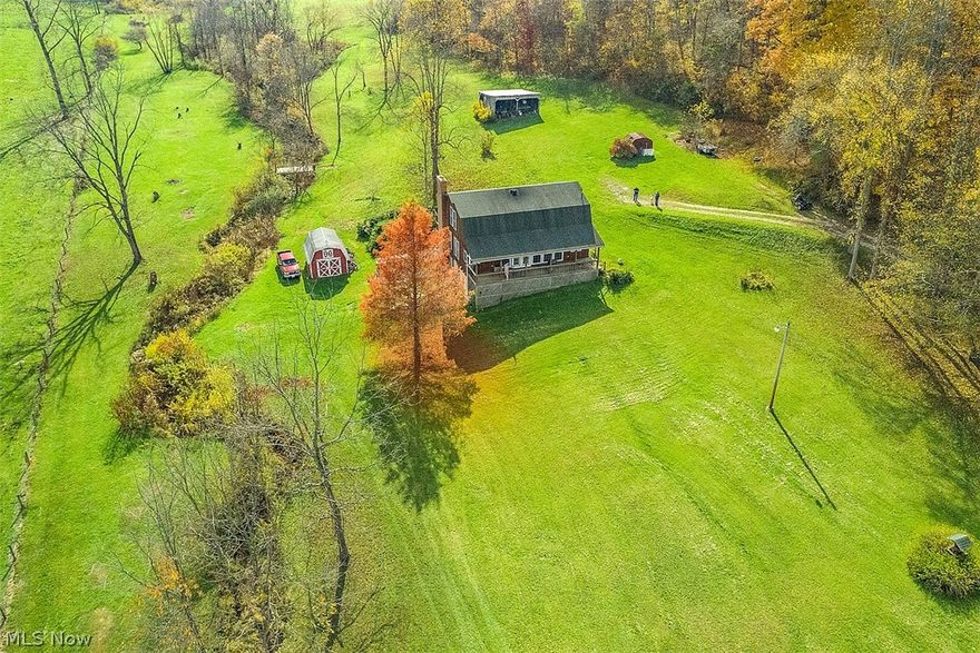 QUAKER CITY/FAIRVIEW!! LOOKING FOR PRIVACY? A QUIET COUNTRY ATMOSPHERE? WELL...How about 46+ acres of it??! This property has soooo much to offer! GREAT sunrises and sunsets as well as loads of wildlife to be admired from the COMPLETE WRAP AROUND DECK of this 3 bed, 2 bath, 1800 SF home! The open concept kitchen, dining room, and living room allows for easy holiday entertaining! Upon entering, you immediately notice the warm neutral color tones, GORGEOUS OAK WOOD and the beautiful staircase leading to the 2nd level OPEN LOFT! The kitchen offers loads of oak cabinetry and an eat-at bar with a view of the AWESOME STONE FIREPLACE in the living room. The lower level houses tons of extra storage space. Water system is spring-fed with a cistern. Seller does not own minerals. Property is under lease. This UNIQUE property is conveniently located only 3 miles to both the westbound (OH 513) and eastbound (Fairview) exits on I-70. DON'T MISS the opportunity to own your own PRIVATE PIECE OF PARADI