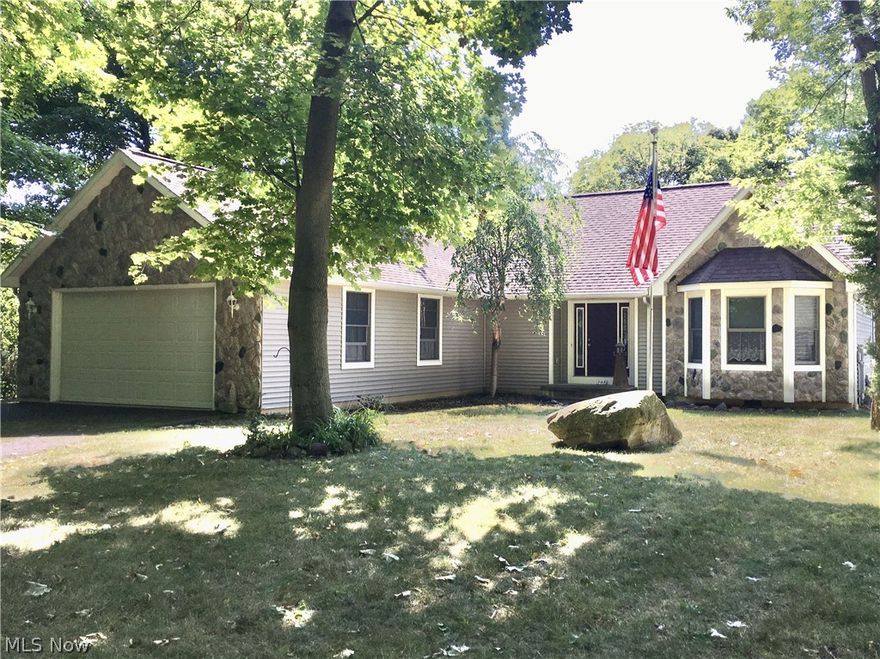 Kelleys Island quiet setting with a lake view! A must see single story home with 3 bedrooms, 2 full baths, kitchen with counter seating and dining area, a great room AND a view of Lake Erie from the home, back patio and backyard. Mature trees provide a lot of shade. Relax and enjoy the island!  Some of the features of the home: Custom built with 2 x 6 construction in 2000.  BR 1 with attached full bath and walk in closet. Sliding patio doors in BR 1, BR 2 and living room.  24 x 28 attached garage with finished walls, EDO and hot and cold water.  Dual hot water tanks. Crawl space with concrete floor and insulated foundation.  Listing does not include furniture or garage contents.