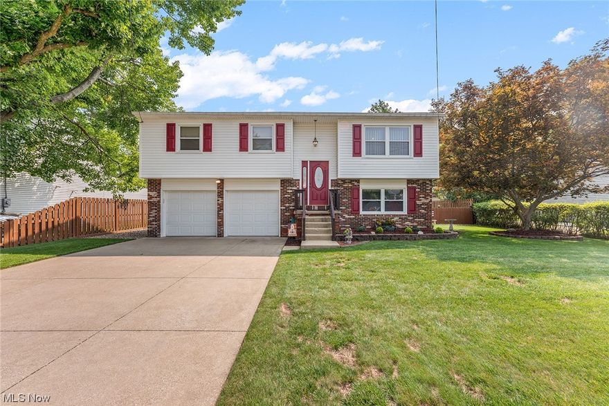 Welcome to this charming 3-bdrm Bi-level home, W/ modern updates & expansive outdoor retreat. A blend of comfort, style, & practicality W/ over 1,400 square feet of meticulously maintained living space, as you step in the front door, you’ll find neutral paint & newer carpeting, plus the vinyl windows show off lots of natural light to open layout of the living room, dining area & updated kitchen W/ Merillat cabinets, Corian counter tops & all kitchen appliances stay, plus breakfast bar, you’ll love to cook in this kitchen! Off dining room, step out to spacious covered 12 x 20 deck perfect al fresco dining, overlooking the fully fenced large yard. Main level has 3 generous sized bedrooms & full bathroom, plus lots of storage. Lower-level retreat has spacious recreation room, half bath, laundry area, then there is the spick & span 2 car garage with Naturestone floors! The allure of this home extends beyond the interior! You can access the yard from the garage or walkout from the recreatio
