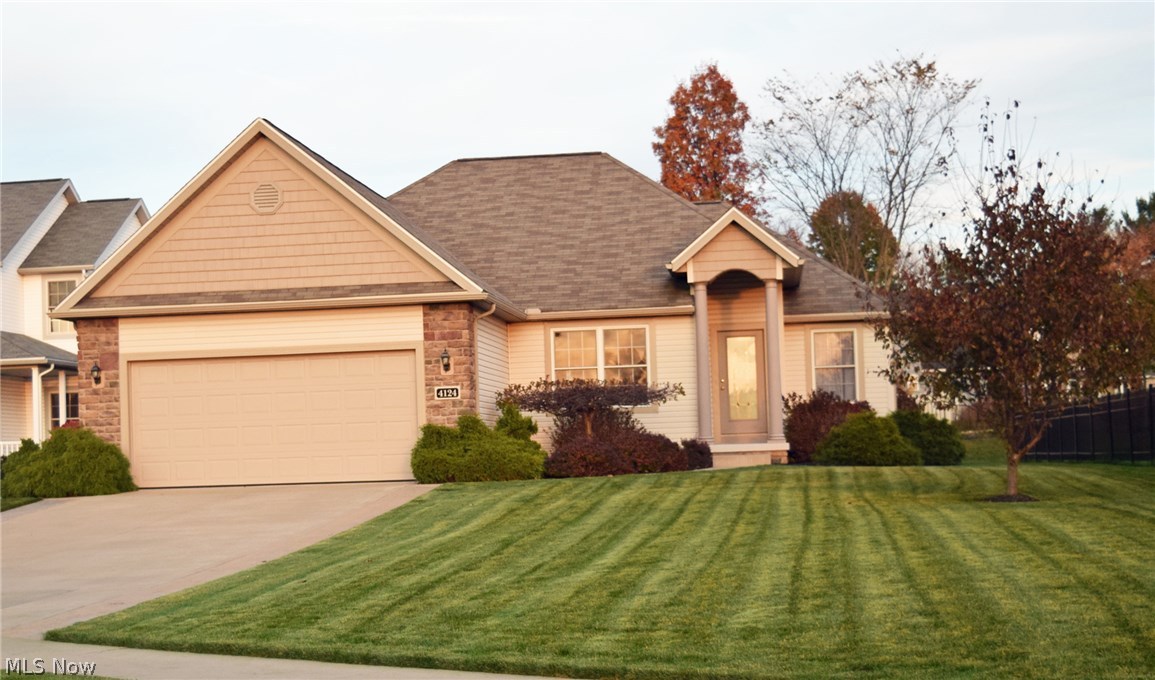 One owner custom Hartland Homes by Larry Yoder in desirable Sterling Green! This luxury Ranch home includes 4 bd and 2.5 baths and a beautiful finished basement. Hand-scraped hickory engineered hardwood throughout the living spaces in the first floor for a pristine high-end finish. The fully applianced open kitchen has views of the formal dining room and great room. This fabulous kitchen features updated granite counter-tops and has a breakfast bar for casual dining and entertaining. The great room features a stone fireplace, 10' ceiling, and patio door that leads to the covered private deck and stamped patio. Large backyard with vinyl privacy fence lining both sides. Owner's suite includes separate bathroom with a dual sink vanity, separate shower, tub and separate toilet room. Owner's suite also includes a large walk-in closet with built in dresser. Split bedroom floor plan with the owner's suite on one side and bedrooms 2 and 3 on the other side of the home. The 12 course full base