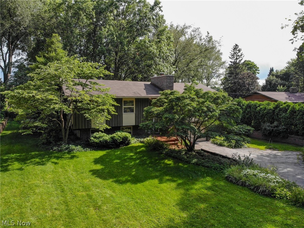 Welcome Home! 231 Trudy Ave Munroe Falls OH 44262 is a beautiful raised ranch split with 3 bedrooms & 2.5 bathrooms, 2 car garage located in park-like setting! Starting from the outdoor space which has shade trees & flowering trees as well as sun lit areas for gardening w/ full back yard fence & pet fence, shed, rear patio & awesome sprawling rear deck for your enjoyment, relax, entertain or grill! Main level incudes vaulted ceiling in the Living Room, Dining Room & Kitchen which has a great layout for every day living as well as entertaining! The Living Room also includes a gorgeous fireplace with newer chimney, recently cleaned lush designer carpet & open feel from front to back! Dining Room opens to the rear deck (so does back sunroom!) as well as opens to the well designed kitchen with all the appliances included, even the washer & dryer are conveniently located in the full size laundry conveniently located to the kitchen! 3 nice sized bedrooms & 2 full baths including an en suite
