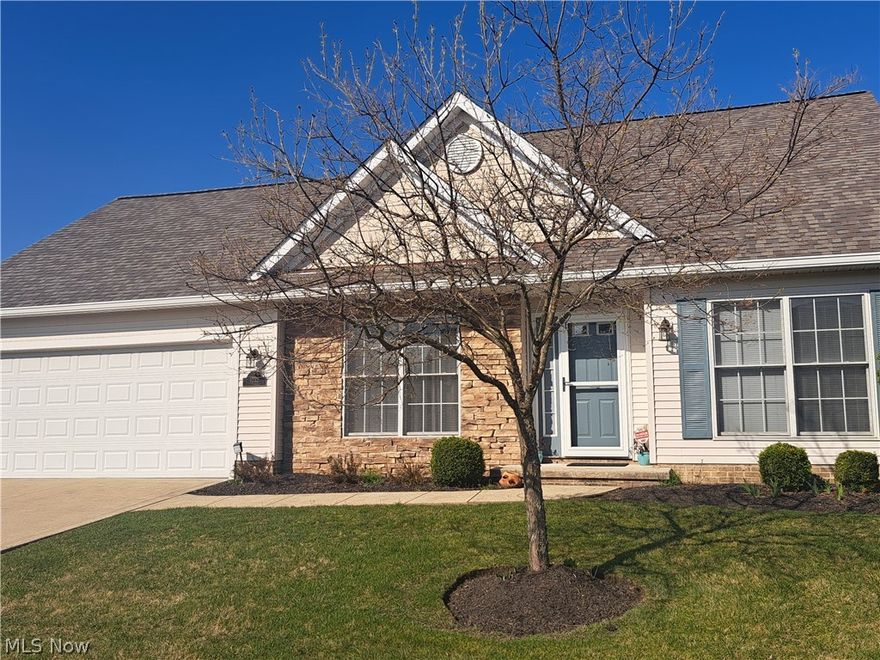 A gorgeous, meticulous and unparalleled Stonebridge condo end unit. The layout and functionality of this home are exceptional and the owner's great taste has made it a showstopper. Nestled in a quiet area minutes from downtown Willoughby, this 3 bed, 2.5 bath stunner is turnkey and move-in ready. It features a vaulted, open concept living room, dining room, kitchen space with a 10 ft bar - perfect for entertaining, a spacious first floor primary bedroom with ensuite bath and two great closets, as well as a first floor laundry room with storage galore. Fabulous lofted space upstairs in addition to 2 more bedrooms and a full bath. Spacious rooms and an abundance of natural light throughout the home. The 2 car attached garage with built-ins makes daily life easy. A small, private backyard outdoor oasis accessed from the eat-in kitchen is perfect for grilling and socializing. This lovely home is perfectly proportioned and appointed, offering a ton of updates including (but not limited to): total interior paint job, new quartz countertops and tile backsplash, new sinks and faucets, newer Riverwalk Oak Vinyl waterproof flooring , new ceramic tile in bathrooms,  all new modern lighting, hardware, screen door, and slider window treatment. Furnace and A/C new in 2021 and roof was replaced in autumn 2023. Pella windows throughout. A true gem with top of the line updates. Well managed condo association with low monthly fees.  This is carefree living at its best. Close to shopping and dining, with easy access to the freeway, downtown Willoughby and beautiful Lake Erie. You do not want to miss this!