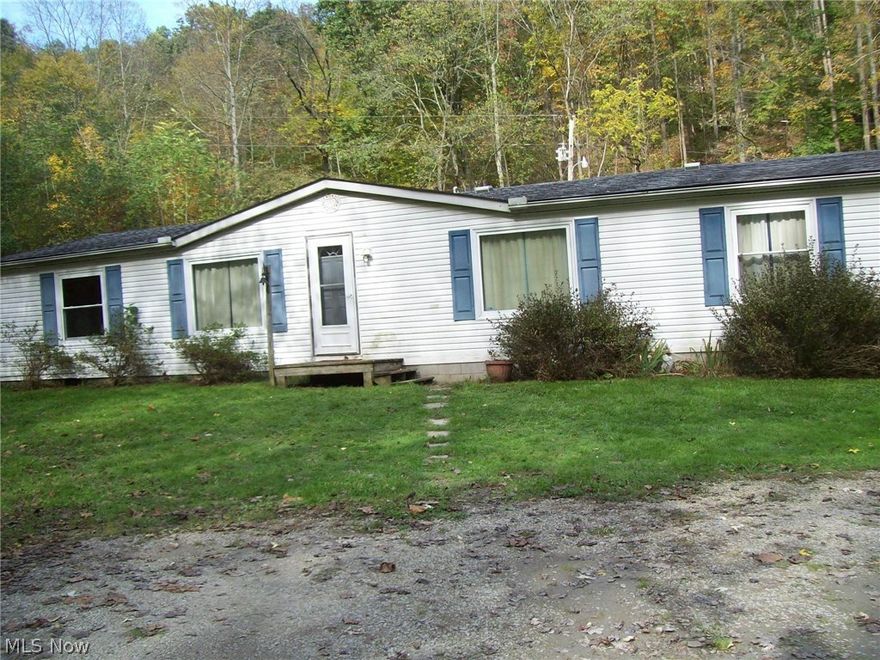 VERY WELL MAINTAINED  MANUFACTURED HOME WITH APPROXIMATELY 20 ACRES.  NEW SURVEY BEING DONE. ROAD FRONTAGE ON TWO SIDES AND ALL MINERAL RIGHTS WILL TRANSFER.  CAUV TAXES  IS FOR TIMBER.  CREEK RUNS THRU PROPERTY. SOME FENCING. HAD LIVESTOCK. HAS A 24 X 24 POLE BUILDING.  A 2014 10 X 20 SHED IN BACK YARD.  GUERNSEY MUSKINGUM ELECTRIC. FOUNDATION IS BLOCK WITH AUTOMATIC VENTS, THICK PLASTIC WITH GRAVEL ON TOP FOR MOISTURE BARRIER.  AERIATOR PUMP ALSO UNDER HOUSE INSPECTED YEARLY. DRILLED WELL IN 1999 BY VERNON BEAL. WINDOWS 2006, ROOF 2008, FURNACE 2013 AND CARPET 2015.  SPACIOUS HOME WITH AMPLE CLOSET SPACE. PROPANE FIREPLACE IN LIVING ROOM FOR A BACK-UP HEAT SOURCE.  BACK DECK IS 10 X 30 LOOKING INTO THE WOODS.  APPROX 4 ACRES CLEARED AND REMAINING WILL BE WOODS.