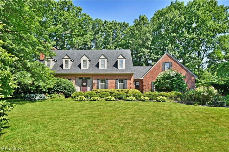 Tee up for a hole in one with this remarkable Warren residence! The massive, all brick estate is 
nestled into a quiet cul-de-sac within a highly desirable community next to Trumbull Country Club. 
Surrounded in tall trees and lush landscaping, the home peers out with its prominent stature and 
row of window lined dormer windows along the roof line. Around the back, you’ll find a paved 
basketball court along with a fenced-in pool area, creating your personal oasis. Handsome 
brickwork leads back up to a tiered patio, perfect for relaxing or entertaining alike. Inside, the grand 
foyer showcases rich hardwood flooring and an extravagant carpeted staircase. Complimenting 
trim work runs along the walls and ceilings, pouring into the deep-set dining room nearby complete 
with fireplace. Opposite, a quaint family room doubles for an easy parlor as you gather with friends. 
A must-see central kitchen highlights bespoke shelving with equally impressive design elements 
such as a recessed range, large island, ornate tile work and an illustrious picture window. Unique 
brick flooring runs underfoot. First floor laundry is available near garage access. Meanwhile, a 
perfectly cultured half bath flanks the living room and its accommodating bar, fireplace, along with 
poolside access. Three substantial bedrooms preside upstairs to include a lavish bath. The 
oversized master includes a closet lined hall and its own full private bath. A fourth is found 
downstairs along with finished rec space. Call today for your private showing!