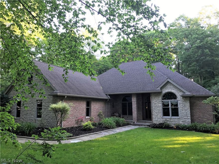 Custom Built Home by Peachy Builders. Custom tile in all bathrooms, kitchen and pantry. Center foyer, formal dining, open floorplan  features private living room, beautiful custom kitchen with granite "walk in pantry". Family room with fireplace, media room. Jack and Jill bedroom arrangement. Spacious Master suite
w/full bath and walk-in closet. Covered patio, full walk out lower level/rough in bath. 3 at garage w/2nd floor bonus room , high ceilings, beautifully appointed. Muskingum Watershed assessment $6/year. Wooded prime lot 4.86 Acres. Storage Barn.