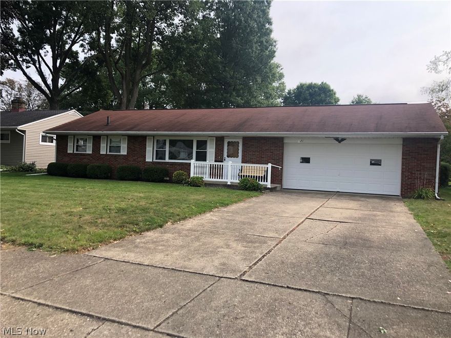 Fantastic Reeves Heights Location! 3 bedroom brick Ranch with 1-3/4 baths! Updated kitchen with appliances. Lower level rec room. 24X25 attached garage. Covered patio overlooking the beautiful back yard. Alley access to back yarad.