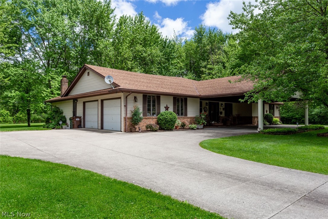 Set back nearly 800 ft & on 7 acres in Elyria Twp, you must see this sprawling ranch with your own eyes to appreciate the depth, beauty, quality, privacy, spaciousness & possible configurations of it. Custom built & truly unique, this home has tons of features (in supplementals) & has been meticulously cared for by the only family to ever live in it. Pull up the concrete drive, pass by the 8-car barn, approach the home, & park under the pavilion car port. As you enter the foyer through the front door you will enjoy the beautiful lay out & view of the home & immediately appreciate it's depth & natural light that enters through the 900 sq ft great room. The great room has sky lights, several glass doors & windows leading out to a deck facing the back. Toward the dining room you will pass 2 rooms, either of which could be used as bedrooms or offices, pass by the hall leading to a bathroom and 2 more bedrooms before taking in the open concept linking the dining room, great room, kitchen,
