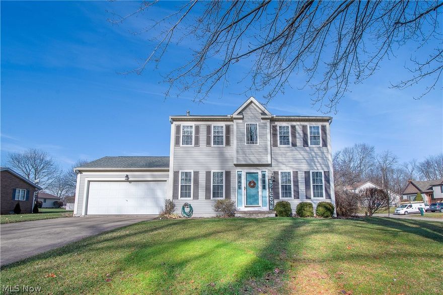 Beautiful two-story home in highly rated Green Local School. Corner lot in Ann Marie Estates Development. This lovely home features an inviting two-story ceramic tile foyer that opens to a formal dining room and office with French doors. Pergo floor kitchen with a pantry, appliances, breakfast bar, and a convenient built-in drop zone. The kitchen opens to the Great room with a gas-burning fireplace, a half bath nearby, and french doors to an expansive 2 tier deck with a Hot Tub overlooking the private backyard. A full bath and three bedrooms, including the spacious master bedroom with a skylight and a master bath with a walk-in closet (6x6), are on the second floor. The partially finished lower level features a large recreation room with a built-in entertainment center, a wet bar, recessed lights, and glass block windows, perfect for entertaining and gathering with friends and family. Shed and a two-car garage. Updates include garage door (2018), shed (2017), French doors to deck, carp