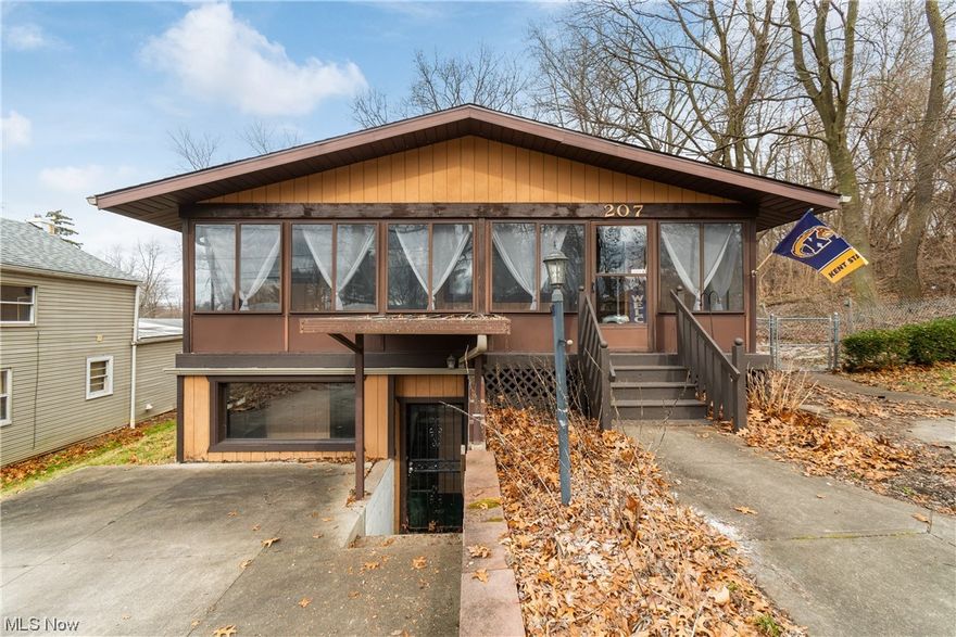 Over 2,000 beautifully finished square foot with walk-out lower level. New roof 2022 on home and 2023 on garage. Open concept first floor with large living room with gas starting wood burning fireplace. Front enclosed porch on both levels. New front door. Large eat-in kitchen has newer stainless steel refrigerator, microwave and range with wireless technology, with sliders to deck and private fenced in back yard that extends all the way to Falcon Court. Newer laminate flooring in kitchen and living room. New carpet throughout. Master bedroom on first floor and full bath with new updated vanity. Lower level offers two large bedrooms, another full bathroom, living room and laundry room with a second enclosed front porch. Plenty of parking! Property has three driveways, two of which are paved. Oversized two car garage offers its own electric panel box and has entrance from Falcon Ct which dead ends into property. Updated electric. Water softener 2021. High efficient furnace. Hot water tank new 2019. All appliances stay including washer and dryer. Glass block windows. Walking distance to Portage Lakes and all that PLX has to offer!! Make an appointment for your forever home!!