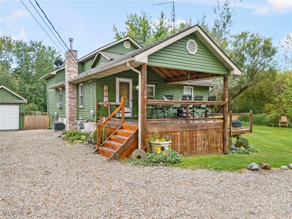 Embrace the peace and nature at this unique and charming property, all while being just a 10-minute drive from the vibrant heart of Belden Village. Imagine the aroma of autumn in the air as you relax in this secluded retreat, the perfect blend of rural serenity and urban convenience. This home invites you to a lifestyle where you can unwind after a day out, whether you've been shopping, dining, or just coming home after a day at work. With its thoughtful one-car garage, two-car garage and shop combination with furnace, cozy home including a main level perfect for easy living, a private upstairs retreat, and a workspace for your hobbies or projects, this property isn't just a house; it's your gateway to a balanced life. The basement has a walk-out basement and offers a third bedroom, as well as a wood burner. The second level has a second stairway/rock wall that leads to a fourth bedroom/storage space/office room.