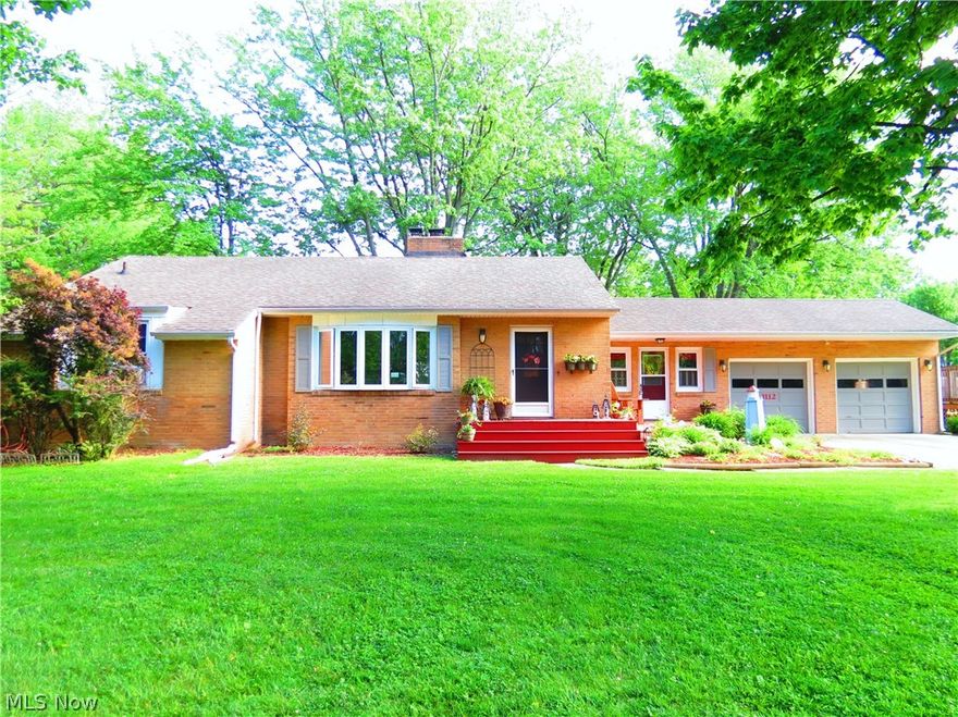 Beautifully landscaped corner lot, above ground pool, comfortable patio, and a well stated all brick ranch home.  The ease and comfort in this home presentation becomes clear with the easy open flow of traffic, swifter maintenance hard wood floors, newly remodeled kitchen with new cupboards, large front bay window, and living room fireplace.  There are 2 bedrooms, 1 full bath on the main floor and a full bath in the basement. The two car garage features 2 garage doors (one automatic), 2 man doors (front and back), and a workbench.  The breezeway entry is a cool summer TV room leading to the covered outside patio.  Newer top load Washer and Dryer  and newer Appliance all stay with this move in condition home.   Across from the Ashtabula Elks club, a minute from KSUAC.  Lake Erie beach/ shoreline rights are stated on the deed. Location of access is undetermined.