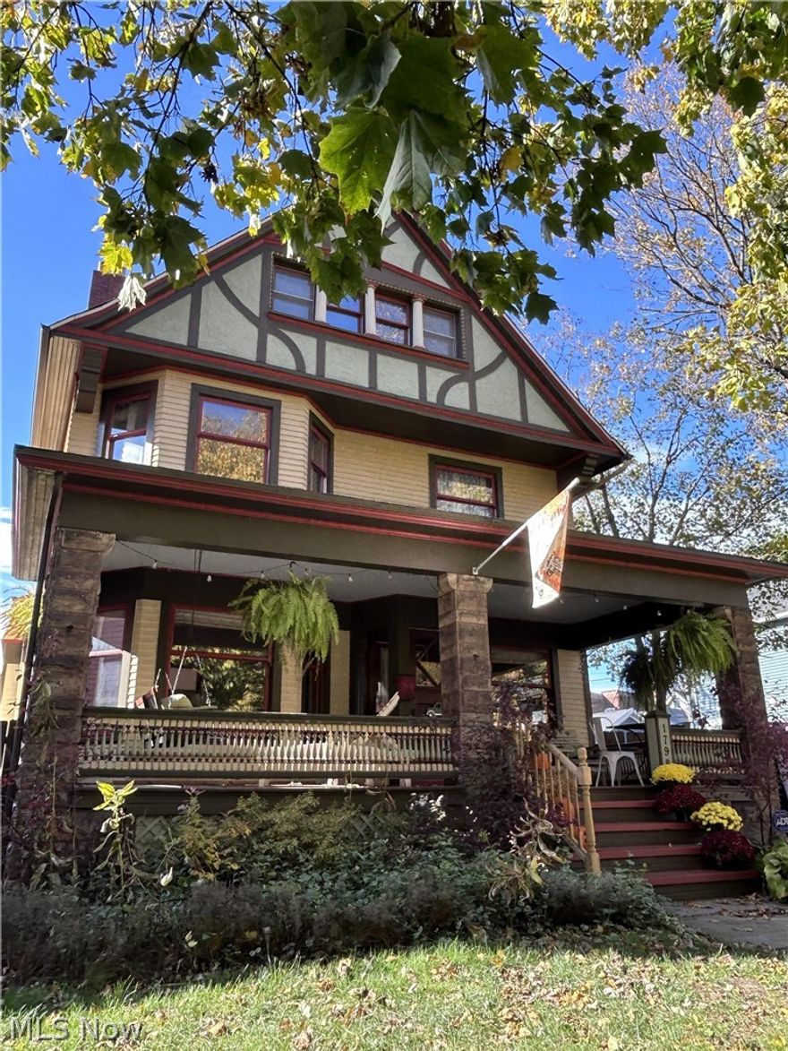 This beautifully restored 1898 Century Home, designed by architect Frederick Baird, blends historic craftsmanship with modern comfort just minutes from Lake Erie, Edgewater Park, Gordon Square and downtown. Located in vibrant Ohio City, the 3 story residence showcases original hardwood floors, detailed woodwork, oak crown molding, pocket doors, chandeliers, double staircase and an ornate tiled fireplace. A wood paneled vestibule opens to the front parlor with stained glass, while the formal dining room can be enclosed with pocket doors. A bright family room features three large windows (new glass in 2024) and a window seat overlooking the garden. The chef’s kitchen, connected by a butler’s pantry, offers dark wood cabinetry, quartz countertops, stainless steel appliances and a center island. A rebuilt back porch (2024) provides inviting outdoor dining and a sunny half bath completes the main level. The second floor includes 4 spacious bedrooms and a renovated full bath (2023) with double vanity and soaking tub. The third floor owner’s suite offers room for a king bed and sitting area, plus a spa inspired ensuite (2024) with jacuzzi slipper tub, fireplace, double vanity, steam shower and a walk in closet with center island. The semi finished basement includes Nature Stone flooring, tall ceilings, flexible recreation space, laundry and storage. Outdoor living shines with a rebuilt composite front porch (2024) with porch swing, hand painted spiral banisters and a fully fenced double lot with areas for entertaining, gardening and play. Features include a stone tiled pergola, firepit, garden beds, fruit trees, raspberry bushes, a detached 2.5 car garage and a vibrant commissioned mural. Major updates include a new roof and gutters (2023), exterior paint (2025), furnace and central air (2022) and hot water tank (2024). This turnkey historic gem offers rare architectural detail, thoughtful updates and serene outdoor living in one of Cleveland’s most walkable neighborhoods.