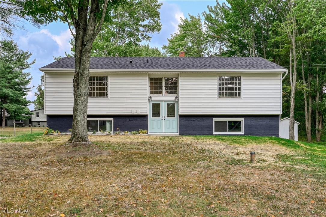 Welcome to this beautifully renovated bi-level home on 5 peaceful acres. Nearly everything has been updated, including the brand-new kitchen, all bathrooms, interior plumbing, flooring, lighting, siding, deck, garage door and opener, most windows and exterior doors, new septic pump, new roof (2024), new furnace and AC (2024), and new electric panel (2025).
The main level offers an open floor plan with the kitchen, dining, and living areas flowing together. The kitchen features white cabinetry, solid surface countertops, stainless steel appliances, white tile backsplace, and an island perfect for gathering. The master bedroom boasts a stylish accent wall and private half bath, with a full bath also located on this level.
The lower level includes a spacious rec room, laundry, a second full bath, walk-out access to the backyard, and entry to the attached 2-car garage.
Outside, enjoy plenty of room to roam with 5 acres and additional barns/outbuildings that offer potential for future use. Property is agent owned.