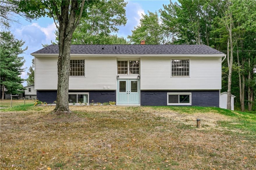 Welcome to this beautifully renovated bi-level home on 5 peaceful acres. Nearly everything has been updated, including the brand-new kitchen, all bathrooms, interior plumbing, flooring, lighting, siding, deck, garage door and opener, most windows and exterior doors, new septic pump, new roof (2024), new furnace and AC (2024), and new electric panel (2025).

The main level offers an open floor plan with the kitchen, dining, and living areas flowing together. The kitchen features white cabinetry, solid surface countertops, stainless steel appliances, white tile backsplace, and an island perfect for gathering. The master bedroom boasts a stylish accent wall and private half bath, with a full bath also located on this level.

The lower level includes a spacious rec room, laundry, a second full bath, walk-out access to the backyard, and entry to the attached 2-car garage.

Outside, enjoy plenty of room to roam with 5 acres and additional barns/outbuildings that offer potential for future use. Property is agent owned. Seller will consider rent to own, lease option financing.