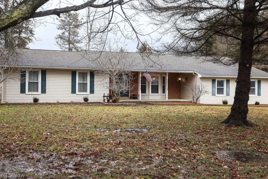 Must see ranch in New Springfield. Call now to see this beautifully updated home on almost 4 acres. Huge kitchen features Maple glazed cabinetry and gorgeous granite counters, large island and stainless steel appliances. The adjacent dining room is open to the kitchen and is a great space for entertaining. Step down Living room with newer wood flooring, brick wall fireplace and beamed ceiling. This is a full four bedroom home. The newly redone master has a great walk-in closet, private bath, sitting area an it opens to a secluded patio of it's own. 3 additional bedrooms and a large main bath for the family. Home has a powder room off of the 2 car side entry garage. Covered patio for outdoor entertaining or relaxing. Property also features a huge outbuilding/shop for storage, cars, wood shop or whatever your needs may be. Fenced pasture area for animals. This home has it all.. call for a private showing.