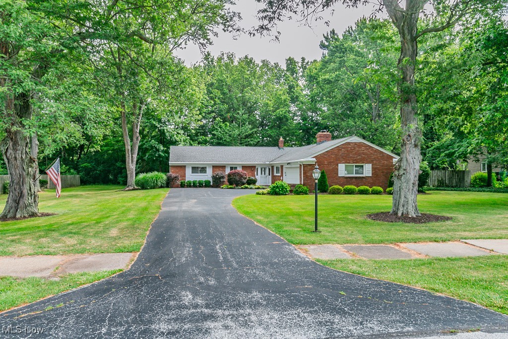 Welcome home to this classic 4-bedroom, 2-bath red brick ranch with crisp white trim, nestled on one of the most desirable streets in Painesville Township. This spacious and well-maintained home offers the ease and comfort of true one-floor living, ideal for those looking to avoid stairs without compromising on space or style. Step into a large, inviting foyer that leads into the heart of the home. Just off the kitchen is a cozy family room featuring a warm wood-burning fireplace and a brightly lit bay window—an ideal setting for casual evenings spent reading a book or watching your favorite movie. The kitchen is bright and open, with neutral décor and abundant counter space, making meal prep and entertaining a breeze. Enjoy the large combined living and dining room which provides even more entertaining space for holiday gatherings. Enjoy the spacious living room, which opens to a park-like, partially fenced backyard complete with a deck and a large shed for extra storage. Each of the four bedrooms are generously sized, offering ample closet space—some with dual closets for added convenience. The master suite boasts an attached bathroom with a walk-in shower, vanity, and a bright window that fills the space with natural light. Whether you’re downsizing, starting fresh, or simply seeking the convenience of single-level living, this home checks all the boxes. Located just minutes from shopping, freeways, and city conveniences, yet tucked into a quiet, peaceful neighborhood, this home offers the best of both worlds.
Don’t miss your chance to make this beautiful brick ranch your own—schedule your private showing today!