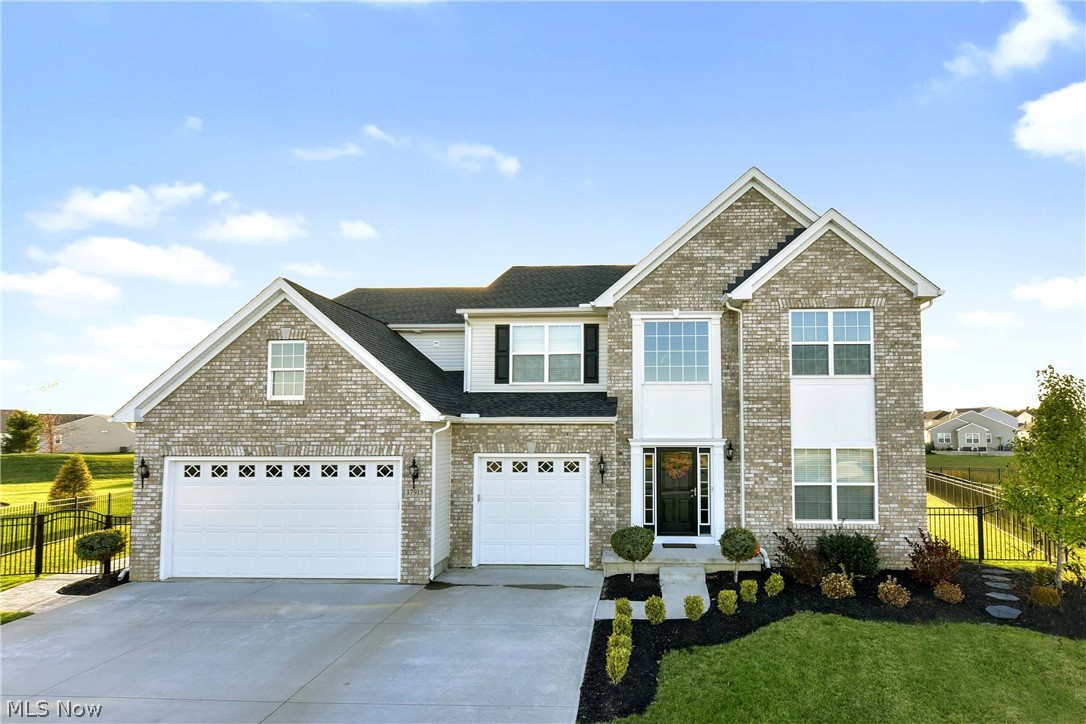 Prepare to be Moved!...Into this spacious colonial in North Ridgeville with a must-see backyard complete with large patio and pond view. This home greets you with professional landscaping, extra wide driveway and 3 car garage. Step inside and you'll immediately appreciate the neutral paint colors, crisp white trim and hardwood floors. Off the foyer is an office space with french doors that can be closed for privacy. A formal dining space with tray ceiling is the perfect spot for entertaining. The kitchen is a chef's dream with beautiful dark wood 42" cabinets, granite counters, s/s appliances and a center island. The kitchen is open to the family room and morning room -all get lots of natural light and enjoy an amazing view of the backyard. No shortage of space in this kitchen with room for a table and chairs and seating at the breakfast bar. Warm up by the fireplace in the family room and keep the chef company! Sliders in the morning room access the large stamped concrete patio
