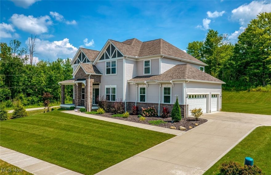 NEW PRICE-$789,000 + $10,000 closing cost credit. Gorgeous 2023 PULTE built beauty checks all the boxes AND is located in the beautiful lake community of HAWTHORN OF AURORA. This home has a striking brick and vinyl exterior as well as a no maintenance Trex covered front porch and a 3 car side load garage. The back yard is lush and scenic with woods in the rear of the property with no neighbors behind or to the left of the house. The dramatic two story arched foyer opens to the library with glass French doors on the left, and a large formal dining room with a tray ceiling on the right. The stunning kitchen has a seating island, upgraded cabinets, granite countertops, tile backsplash, stainless appliances including 5 burner gas cooktop, wall oven and microwave, high power range hood and walk in pantry. The open concept kitchen and the great room make for easy entertaining.  Sunlit great room w/wall of windows and a gas stone fireplace from floor to ceiling. The "other room" is planning center with built in desk-great for doing homework or paying bills. Back staircase with wrought iron railing leads to 4 bedrooms and 3 full bathrooms plus a huge LOFT/FAMILY ROOM! The primary suite has a glass shower, spa tub, double sink vanity and large walk in closet. The other bedrooms share a bathroom AND there is an ensuite bedroom/bathroom with a walk in closet. The recently carpeted full basement is plumbed for a bathroom, and is ready for final finishing. Luxury vinyl throughout the first floor. Cubbies off garage entrance and 2nd floor laundry room. Powder Room could be expanded to add a shower & a door connecting to the library to creeat a GUEST SUITE. HAWTHORN includes a 305 acre lake with boating, fishing, swimming pools, 2 lighted  tennis courts, pavilion, bocce ball courts + clubhouse that can be rented out. Close to Aurora Farms, many great restaurants, Heinen's Grocery store, Orchid House Winery, Kiwanis-Moore Park Splash Pad, summer concerts. Top Rated Aurora Schools!