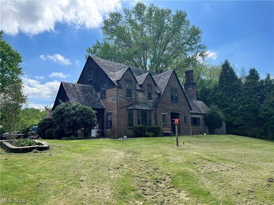 If you're looking for old character and pure class, look no further, THIS IS IT! Beautiful brick and stone home built in 1939. Large living room that leads out to a patio in the private back yard. Gorgeous staircase in the foyer of the front door. Large dining room that flows into the newly remodeled kitchen, which includes granite countertops. One of four bedrooms is on the main floor with a full bath attached. Three bedrooms upstairs. Main bedroom is attached to a full bathroom. Plenty of closet space throughout the home. Beautiful woodwork and built ins also throughout. This remarkable home sits on almost 2 acers and is tucked back in off the main road, giving a nice sense of privacy. Never worry about being in the dark on stormy nights due to the whole house generator. Also, included is a 2-car detached garage and large outbuilding. This is a must see! You will not be disappointed! Schedule your private tour today!