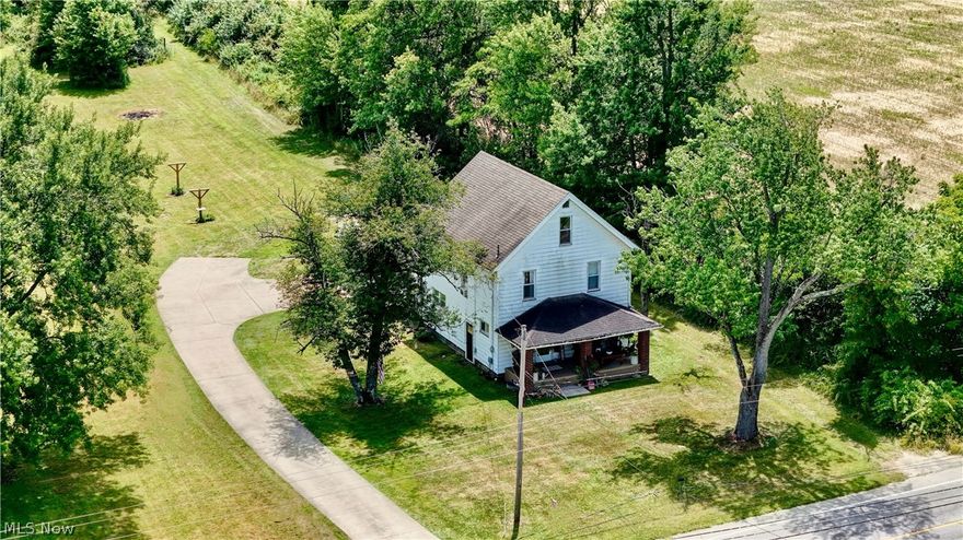 Character meets convenience in this single-family dwelling built in 1900. Step into comfortable living and enjoy close proximity to town, while having 43 acres of land to do what speaks to you! Whether it’s for a hunter's wonderland  or potential hobby farm, you can decide! The acreage also makes for an exciting off-road riding hideaway. Plenty of room for gardens, too! Last, but certainly not least, enjoy FREE GAS and royalties.

Inside, enjoy a newly installed kitchen with cottage core flare. A well placed spacious pantry awaits your dry goods.  This two-story also features a mudroom with laundry, tile floors, and full bath on the main floor.  Upstairs there are three bedrooms and one full bath with access to the large attic. The bedrooms feature closets that are surprisingly roomy for the era.
Rustic hardwoods throughout second floor. Main floor living encompasses wood and ceramic tile.  You will find nods of character to 1900 throughout, including the pocket doors in the dining room, living room archway, built-ins and the wood staircase and spindles.   2 car attached garage and all appliances included. Public utilities!
Schedule a viewing today and see everything that this property has to offer!
