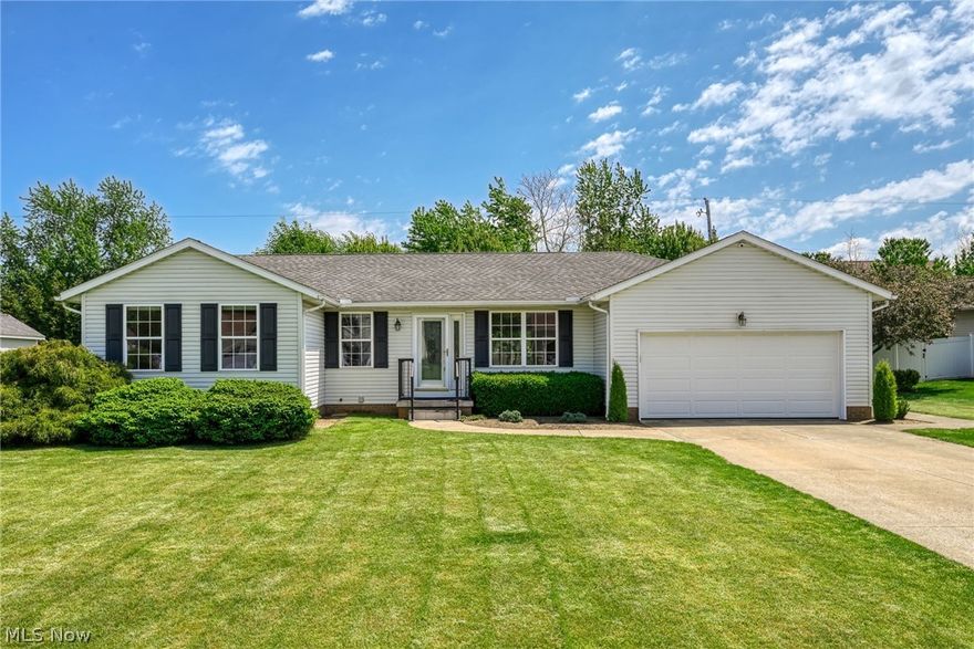 Welcome Home! Enjoy the ease of one-floor living in this immaculate, well-maintained 3-bedroom, 2-bath ranch, perfectly located near shopping, dining, and everyday conveniences. Offering 1,560 sq. ft. plus an additional 312 sq. ft. finished rec room, this home features an open floor plan ideal for both relaxing and entertaining. The spacious great room with hardwood flooring flows seamlessly into the dining area, highlighted by a charming corner brick fireplace with gas logs and access to the 12 X 12 composite deck and private backyard through sliding glass doors. The beautifully updated kitchen includes all appliances, hardwood flooring, quartz countertops, and a large center island with breakfast bar and butcher block top-perfect for casual meals or gatherings. Convenient first-floor laundry includes washer, dryer, utility sink, and ceramic tile flooring. The owner's suite features built-in cabinetry, a walk-in closet, and a private bath with step-in shower and comfort-height vanity. Two additional bedrooms with generous closets and ceiling fans share a full bath with tub/shower combo and built-in linen storage. The finished lower-level rec room (13x24) provides extra living space along with ample storage. Relax and enjoy the summer and outdoor living on the 12x12 composite deck. Additional highlights include a 2-car garage and major mechanical updates: furnace and A/C (2019) and hot water tank (2025). Fantastic location near Kent State Stark, minutes to I-77 and Akron-Canton Airport. Move-in ready with neutral 
décor-don't miss this opportunity for convenient, low-maintenance living!