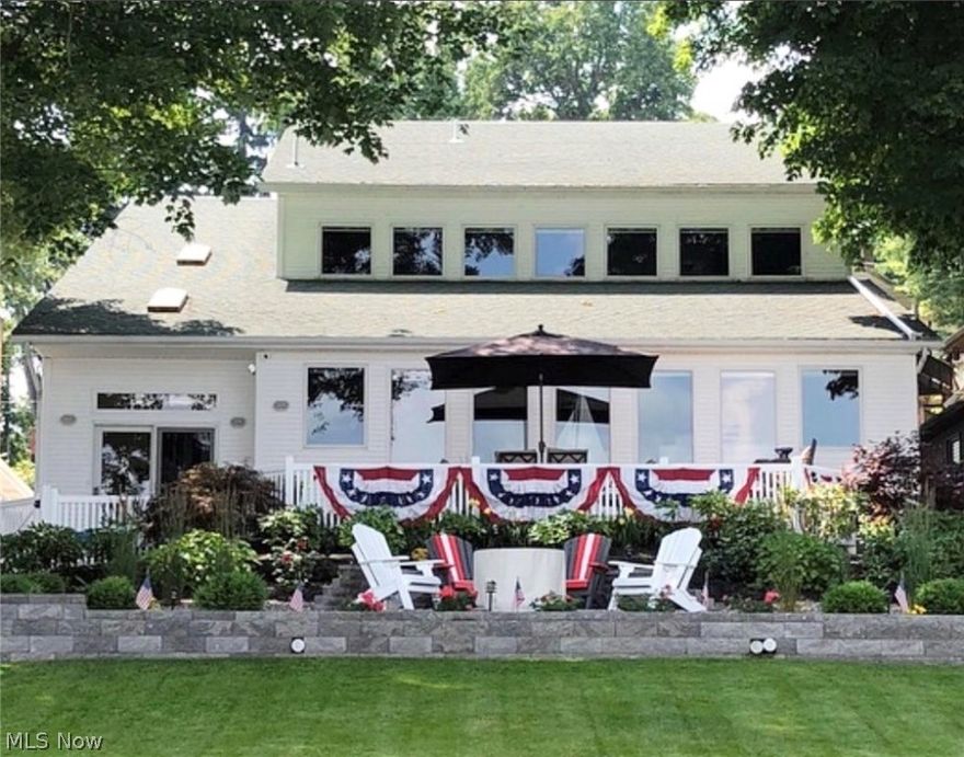 Uncompromised style & comfort can be found in this lake front home. Stunning views from all 3 levels w/entertaining made easy. Welcoming foyer opening to lrg dining room w/custom professional bar w/lighting & seating open to gourmet kitchen w/matching breakfast bar seating, granite, stainless, even added ref. drawers, also a walk-in pantry for amazing storage. Open concept Dining adjoining Living space w/fireplace w/wall of windows & bamboo floors throughout. A special sunroom w/rad heated floors will prove to be very inviting along with sunning deck.  Home office or nursery. 3 master suites will provide a haven in elegance, each having its own stunning bathroom & walk-in closet. This home is the complete pkg, it has a media room wired for projector for special game days or movie nights with half bath. Even included is an exercise room if using your composite dock w/kayak storage is not enough. The lower level rec/game room will add to your memories. Completely new landscaping around e