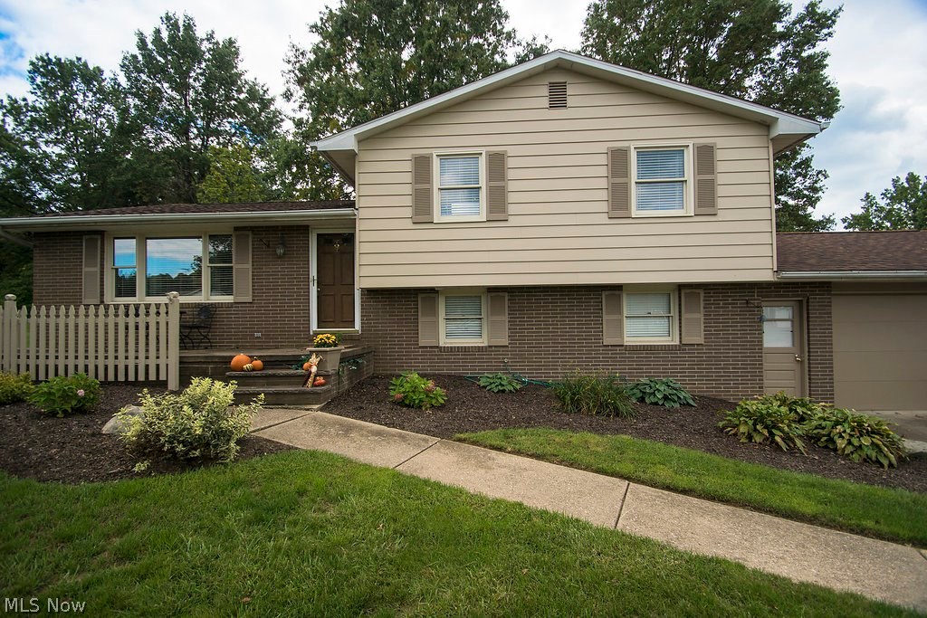 What a value!!! This 4 level split, located in one of the top school districts in the state, features 4 bedrooms, 3 full baths, newer appliances and garbage disposal, 4 year old roof, 2 yr old 90% efficient gas furnace, central air, new flooring throughout, including plush carpet, ceramic tile and wood laminate, covered patio with fire pit, 1 year old hot water heater, cherry cabinetry in kitchen, newer counters in bathroom, 2 car attached garage with garage door opener and storage above with attic steps in garage, storage shed and so much more. This great home is nestled on a 133 x 150 lot, with gas and electric averaging apx $170/mo. The main level has foyer entry, living room, dining room and kitchen. The upper level has 3 bedrooms and 2 full baths, including a master suite and the 3rd out of 4 levels offers a full bath, plus a warm and welcoming family room with wood burning fireplace and sliding doors to the fire pit & 13x13 covered patio. The 4th and final level is the basement,