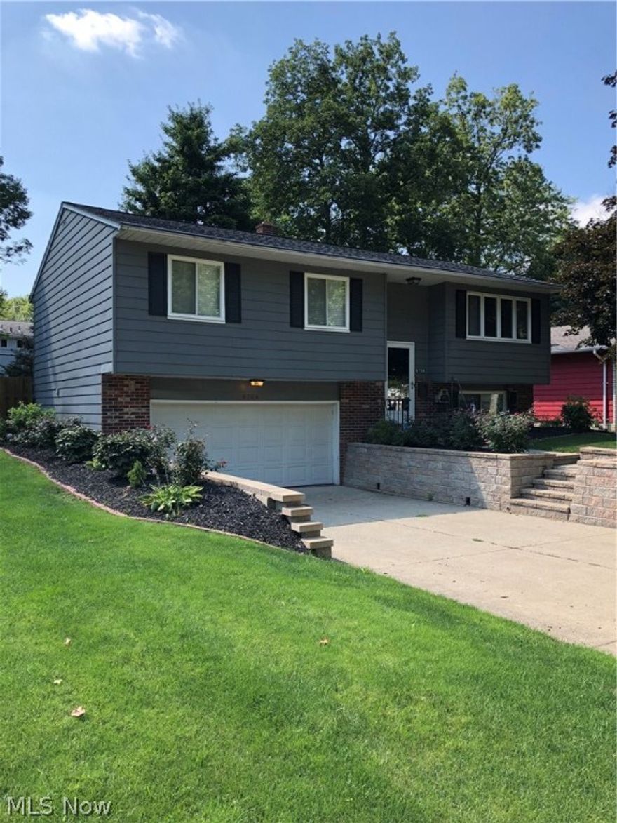 Fully updated with a seller paid home warranty! Don't miss this gem in Solon with 3 bedrooms, 1 1/2 baths, a three season room, new flooring throughout (2017), freshly painted two months ago, new sink and counter tops (2018), lush full wood fenced backyard with shed, two and a half car garage with a new garage door and door opener, brand new beautiful retaining walls and professional landscaping. Priced to sell fast.