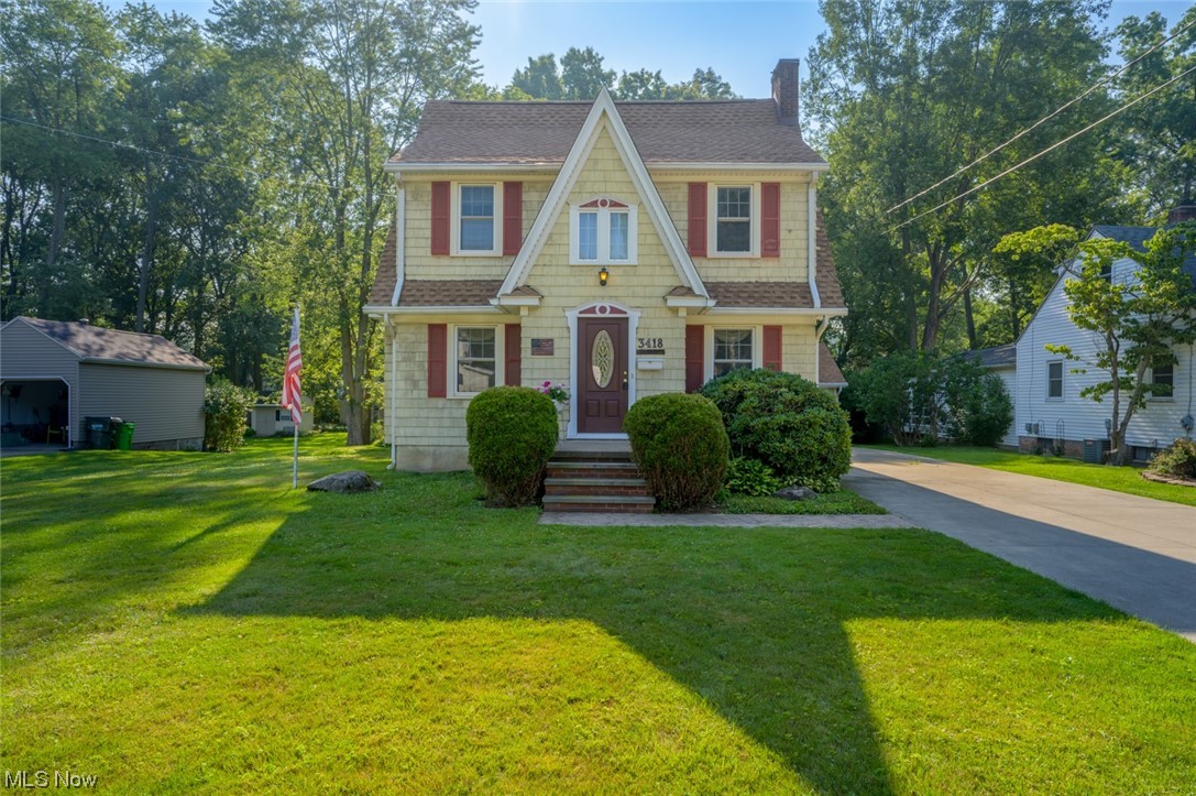 Welcome to 3418 Oak Rd! Located on a beautiful tree lined street right in the heart of Stow! This lovely home is situated on a picturesque lot and is full of character and original details. With over 2,100sq/ft. of living space this home features a living room, dining room with window seat, large eat in kitchen with original built ins and a family room with fireplace and 1/2 bathroom. The second floor features a large primary suite with vaulted ceilings, large bathroom and second floor laundry. 3 additional bedrooms, one with an adorable window nook, with oversized closets and the main bathroom round out the second floor. The walk up attic could be finished into a bonus room or loft space! Original hardwoods possible under the carpet throughout the first and second floors. Outdoors you will find a large deck, side concrete patio, 2 car garage, and oversized shed with electric. Updates include Furnace/Humidifier 2022, Roof 2019, A/C 2017.