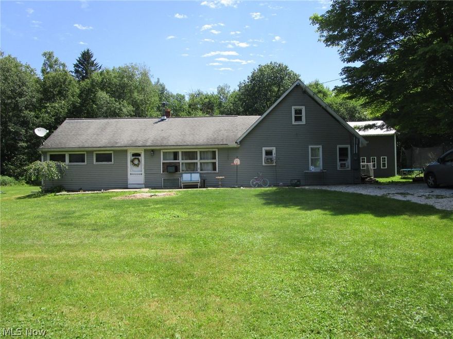 Privacy reigns supreme at  this super secluded 5 bedroom home on 4 acres! With your nearest neighbors almost 1/4 mile down the road, you're tucked away on your own private preserve. Relax and enjoy nothing except the sounds of birdsong and breezes as you take in the wooded views in every direction. As an added bonus, free gas heat is included, as long as the production continues. Mineral rights are excluded, but the free gas is yours! Just imagine NO heating costs...!! The Seller will be providing a new boundary survey prior to close and just had the septic cleaned July 2024. Located just south of Rt. 6, you'll have quick easy access to Routes 45, 46 and 11 for an easy commute to just about anywhere you need to go. The large detached barn/garage is 32 x 24 and provides a great space for vehicles, livestock, toys or a workshop. Tons of yard space here for entertaining, gardening, kids, pets and pasture! Living room offers a cozy wood burning stove to quickly take off the chill on a cool evening. The large second floor bedroom is HUGE and could also easily be used as a home work out area, office, play room or possibly be split into 2 more bedrooms. The first floor laundry room features a large pantry and is conveniently located just off the kitchen, next to the BIG master suite, which also has its own entry/exit door to the back yard.  Although the house is on a slab, there is a small crawl space area under the laundry room installed by the seller as a storm cellar in case of extreme weather. Call your Agent today and schedule soon!