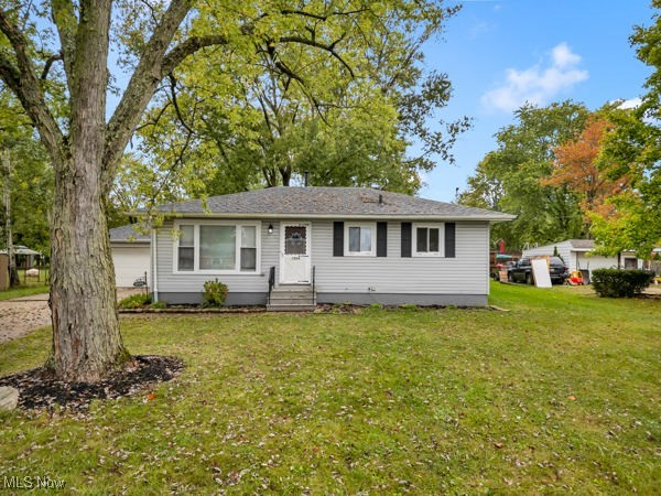 Welcome to this beautifully refreshed home featuring a spacious front entry into a bright living room that flows seamlessly into an updated kitchen with new appliances and an eat-in area. The main level includes three generously sized bedrooms and an updated bathroom. The finished basement adds a versatile living space with an additional room and a full bathroom featuring a walk-in shower, plus a large recreation room for entertaining or family activities. A back door off the kitchen leads to a large, flat backyard, perfect for outdoor enjoyment. Additional highlights include a two-car detached garage with extra storage, new blinds throughout, a two-year-old roof, fresh paint, and new flooring throughout the home. This property presents a turnkey opportunity in a highly desirable location.