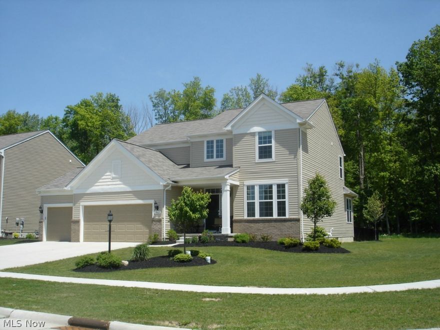 Luxurious colonial located in one of Strongsville's newest neighborhoods. Just off Whitney Road you will find this gorgeous home nestled on a cozy corner lot at the back of the development.  The quaint porch welcomes you into the dramatic two story foyer. Opens to a large family room offering high ceilings that are shared with the kitchen and dining area.  A first floor bedroom has its own full bath just in case you have guests.  The natural sunlight available through the sunroom brightens the kitchen and living room.  42" cabinets add space for all your storage needs and a touch of elegance to this fabulous kitchen.  All stainless steel appliances are included as well as the washer and dryer.  The master suite opens to a large soaking tub adjacent to an all glass walk in shower. Second level seating area separates the main bedroom from the two bedrooms on the other side of the home.  A bath is shared by the 3rd and 4th bedroom. Stunning is the only word to describe this home.  Hurry !