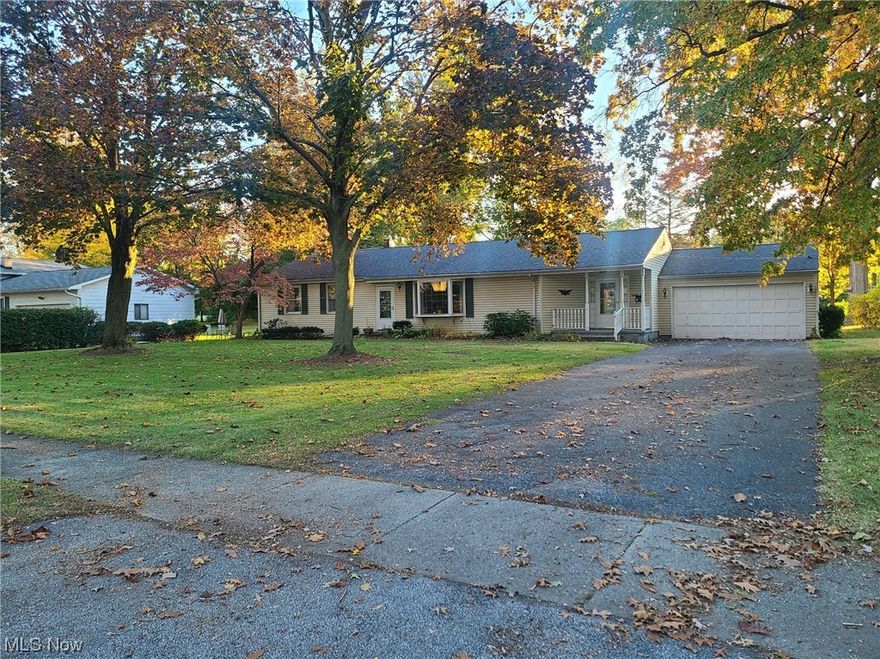 Great opportunity to own a sprawling vinyl sided ranch home on a lovely, 1/2 acre lot that overlooks a large, beautiful park. Longtime owner has maintained the home nicely. Brand new carpeting in the sunroom, dining/flex room, and rec room in basement. All the mechanics & roof have been updated including a lovely bay window. Double pane wood windows throughout and glass block in the bsmt. Brand new central air unit in 2023, furnace was installed in 2016, roof is approx 10 yrs old.  Maple, 32 inch, Kraftmaid cabinetry with pull out drawers. Just needs new flooring to make this eat in kitchen really pop. There are hardwood floors under the carpeting in most rooms and a cozy four season sunroom. There is space for a 1st floor laundry but currently the laundry is in the basement. Excellent location on a quiet street and yet conveniently located to shopping, restaurants, medical facilities, schools and the freeway.