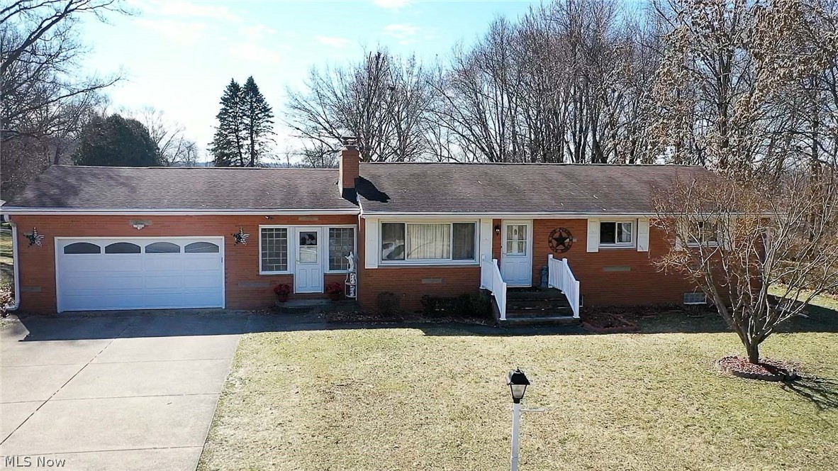 Adorable three-bedroom ranch home in "Excellent Rated" Green schools. This lovely brick home sits on .60 acres with 1496 Sq Ft of living area and great curb appeal! You will love the gorgeous updated eat-in kitchen features new white Kraft Maid cabinetry, beautiful tile backsplash, granite countertop, newer appliances, luxury vinyl tile flooring, a pantry, and a dinette area with a lovely bay window overlooking the backyard. The living room has a wood-burning (stone surround) fireplace and a picture window with plenty of natural light. One of the three bedrooms has a half bath in it, and there is another full bath (recently updated) on the main floor. The clean and bright basement could quickly be finished as extra living space and offers a laundry area, a walk-in shower, glass block windows, and plenty of storage space. A cozy heated breezeway connects the two-car garage to the house with a walkout to a charming gazebo with a privacy fence, perfect for enjoying on warm summer nights.