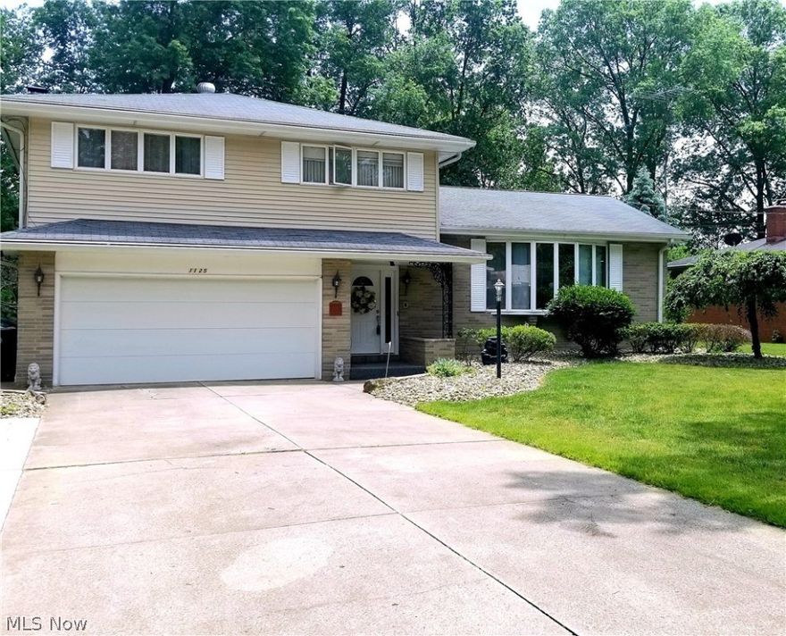 Step into this beautiful tri-level split home, nestled in one of Howland's most charming neighborhoods. An elegant winding staircase welcomes you at the entrance of a lovely foyer displaying only a fraction of the homes grand woodwork throughout. The first level features a spacious family room great for relaxing with guest around the fireplace, and also a half bath. The second level has an eat-in kitchen which features granite countertops, a late model electric cooktop and in-wall oven. Off of the kitchen is a large dining room with stunning wooden floors leading to the huge living room area, which features a dazzling bay window. The third level houses three spacious bedrooms with the master having an on suite bath. A new heated sunroom and finished full basement with plenty of storage space are a few of the many additions in which this home features. Close to the area's finest shopping and dining, this home is a must see.