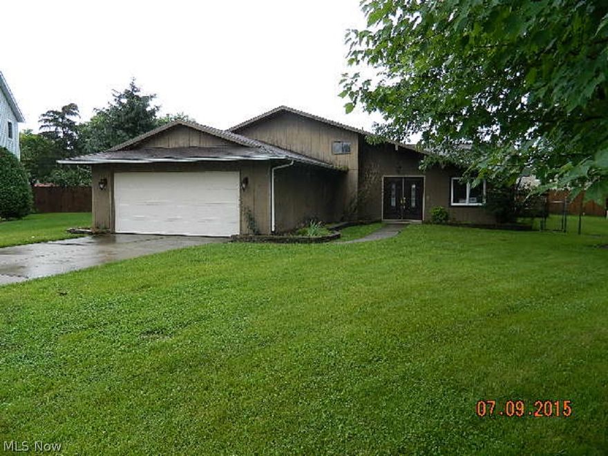 This is a HomePath property. Nice split-level home in Elyria! Convenient to shops, schools & park. Double door entry to polished wood floors in living room and dining room. Open, eat-in kitchen with plenty of cabinets and pantry. Lower level family/media room with brick fireplace, half bath, bonus work room and inside laundry room. Spacious bedrooms upstairs. 2-car attached garage. Custom wood deck in back yard with room for pool! A must see!