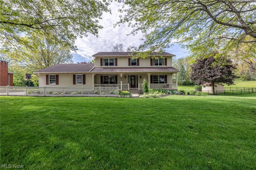 Welcome home to this beautifully maintained Colonial nestled on a quiet cul-de-sac and enhanced by a new aluminum fence, offering both charm and curb appeal. An inviting front porch welcomes you into a warm and spacious interior designed for comfortable living and entertaining.

The heart of the home is the stunning eat-in kitchen featuring quartz countertops, tile backsplash, a built-in planning desk, and an open flow into the cozy family room with rich wood flooring, a fireplace, and custom built-in cabinetry. A spacious formal living room ? perfect as a home office or flex space ? along with a formal dining room and convenient first-floor laundry complete the thoughtfully designed main level.

Upstairs, you?ll find generously sized bedrooms including a luxurious owner?s suite with a walk-in closet and beautifully updated spa-like bath featuring granite countertops, heated floors, and a walk-in tile shower. The updated hall bath also offers granite countertops and tile flooring.

Step outside to enjoy the impressive multi-tiered composite deck overlooking the expansive, park-like .88-acre backyard ? an ideal setting for relaxing, entertaining, or enjoying nature. The backyard also features a charming wooden bridge, storage shed, and plenty of open green space.

The walk-out lower level adds exceptional versatility with a huge rec room, an additional room with an adjacent full bath, and another flexible space ready to become your home gym, office, hobby room, or guest suite. Walk directly out to the lower-level patio and enjoy seamless indoor-outdoor living.

Additional updates include Anderson windows (2019), new carpet (2021), and water heater (2024/2025). This move-in-ready home combines timeless style, modern updates, and an incredible setting you won?t want to miss.